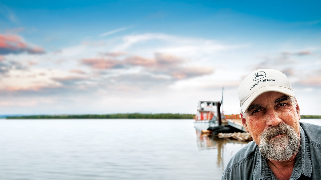 Customer and fisherman on the dock, looking at camera