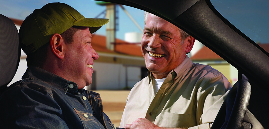 Dealer and customer reviewing a warranty plan