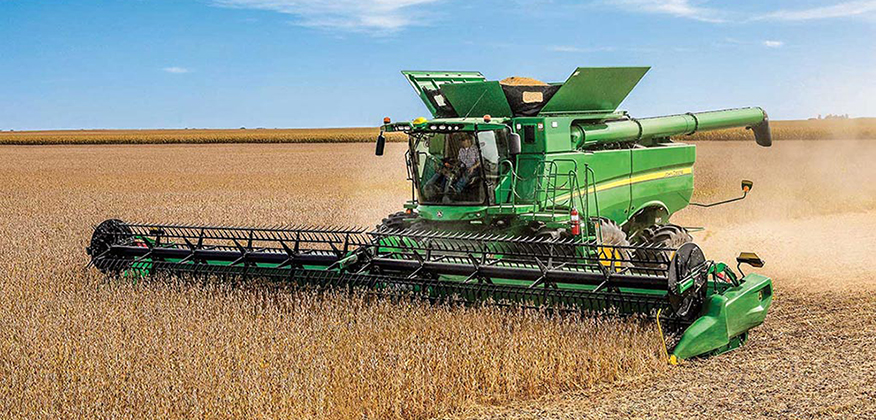 Harvest Precision Upgrade a combine harvesting wheat