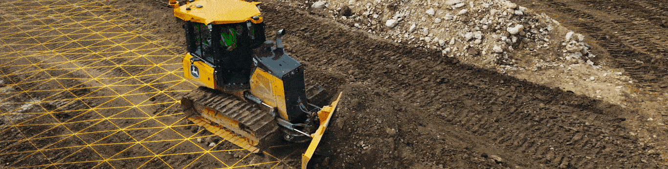 A bulldozer with a yellow grid overlay on the ground, working on a construction site.