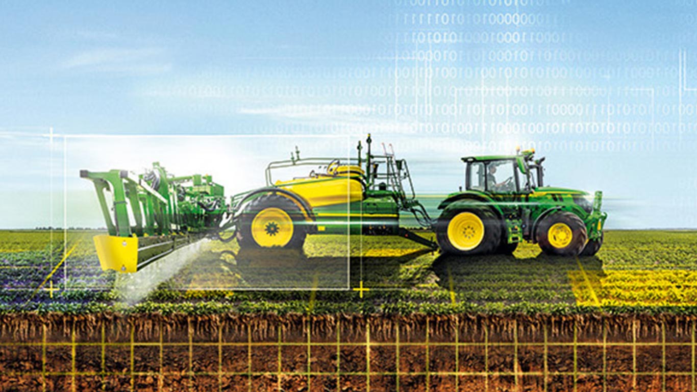 Green and yellow tractor spraying crops in a field with digital overlay elements