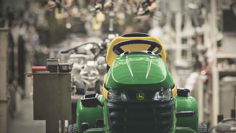John Deere ride on mower in factory setting