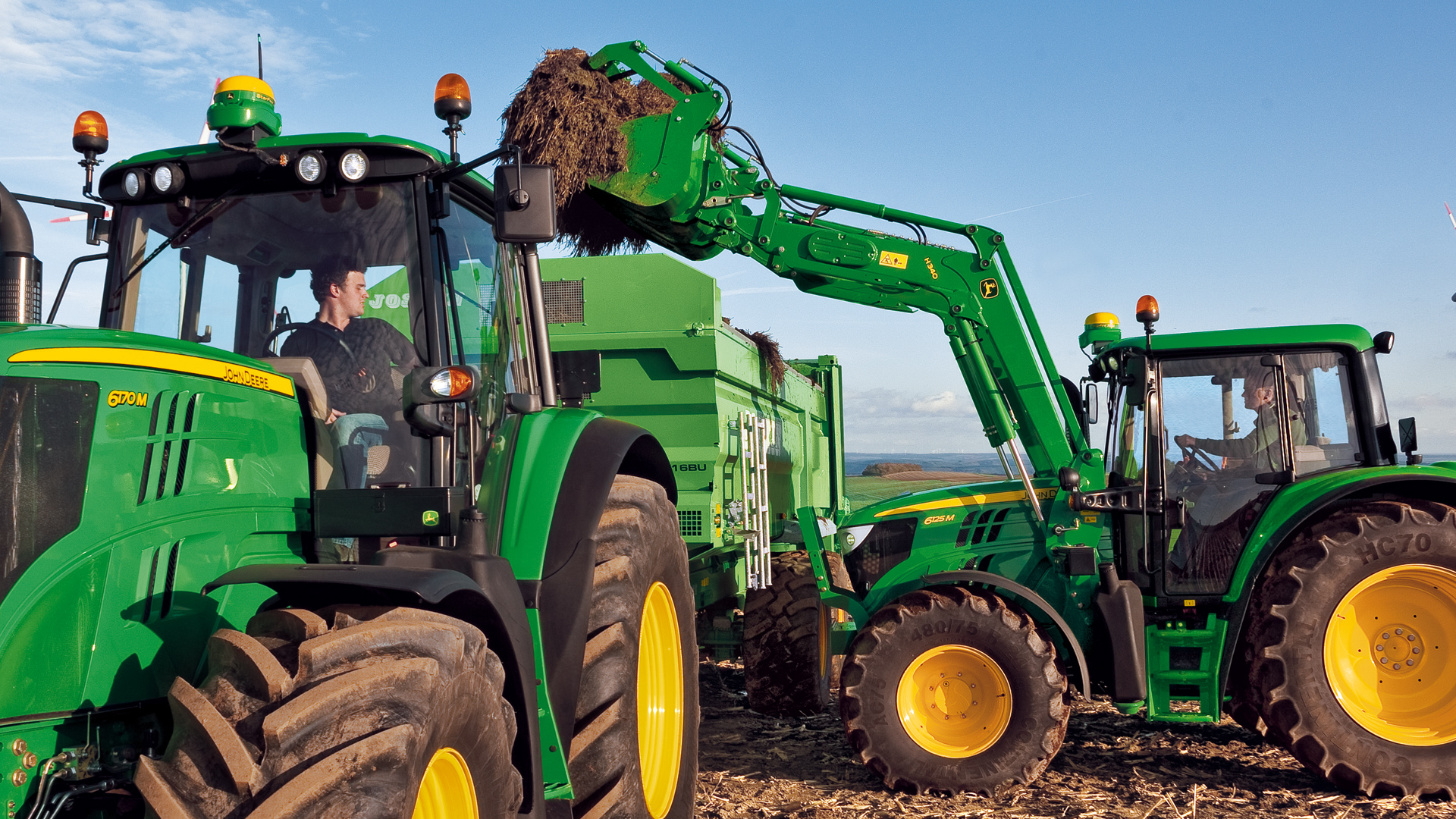 image of tractor working with attachments in field