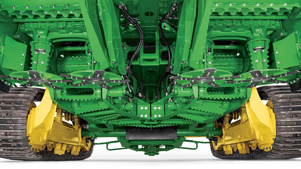 A close-up photo showing the redesigned split feed train system under a CH9 Sugar Harvester. A close-up photo showing the redesigned split feed train system under a CH9 Sugar Harvester.