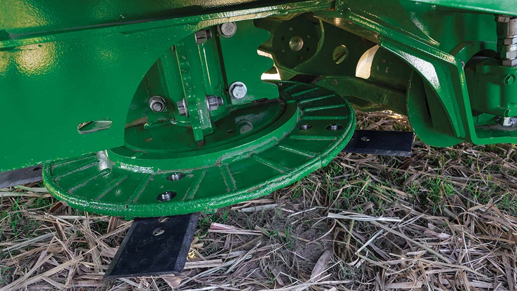 Close-up photo showing the center-driven basecutter on a CH Series Sugar Harvester. Close-up photo showing the center-driven basecutter on a CH Series Sugar Harvester.