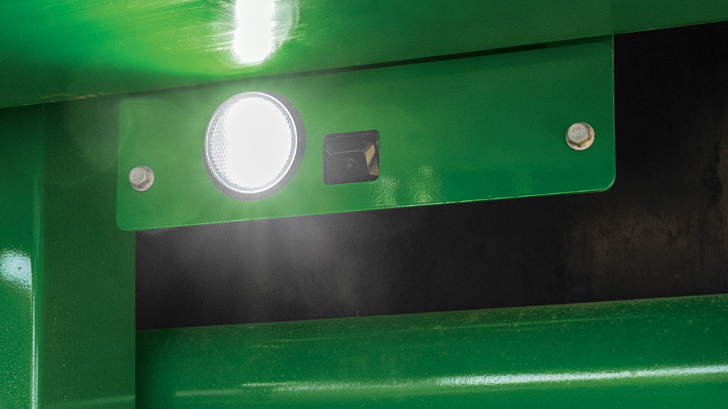 Close-up photo showing the base cut view camera under a CH Series Sugar Harvester. Close-up photo showing the base cut view camera under a CH Series Sugar Harvester.
