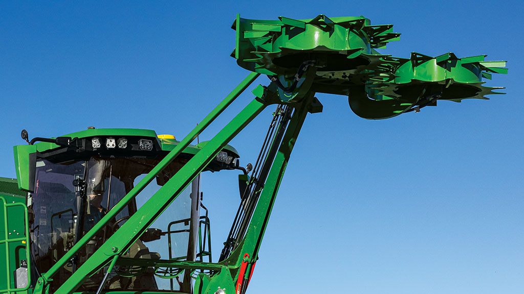 Close-up photo of the raised topper on a CH Series Sugar Harvester. Close-up photo of the raised topper on a CH Series Sugar Harvester.