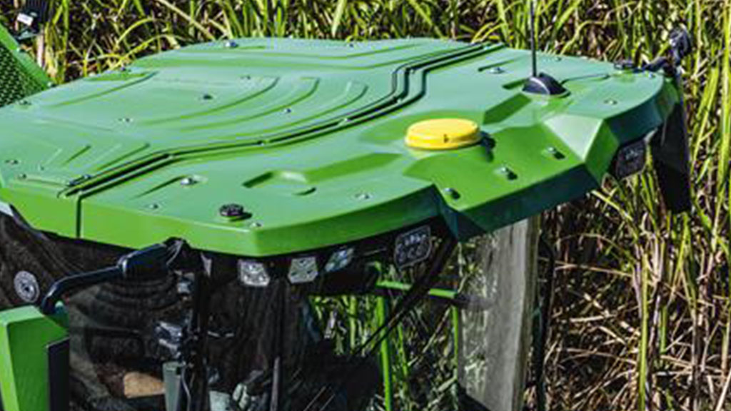 Overhead photo showing an integrated StarFire Receiver on the cab roof of a CH Series Sugar Cane Harvester working in standing crop. Overhead photo showing an integrated StarFire Receiver on the cab roof of a CH Series Sugar Cane Harvester working in standing crop.