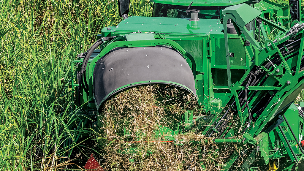 Close-up photo showing cane trash flowing from the optimized primary extractor on a CH Series Sugar Harvester. Close-up photo showing cane trash flowing from the optimized primary extractor on a CH Series Sugar Harvester.