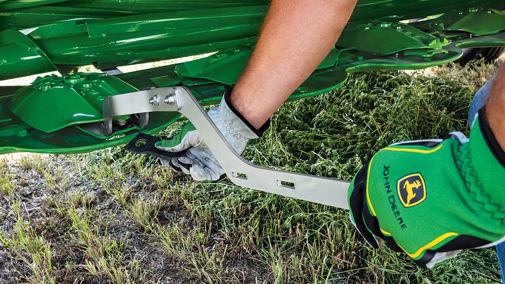tractor and mower conditioner in a field tractor and mower conditioner in a field