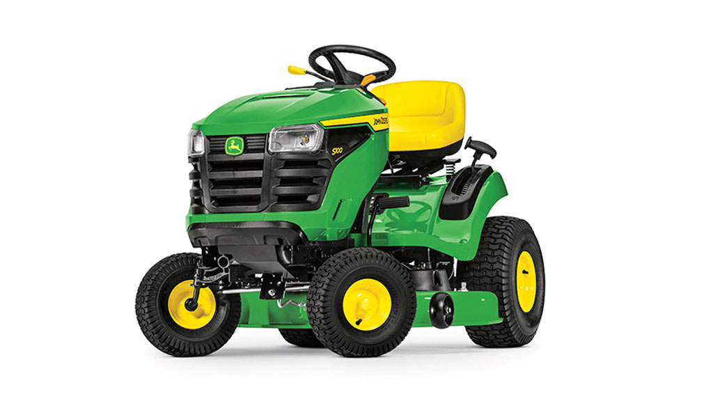 Green and yellow John Deere mower with yellow seat, black wheel, and large tires.