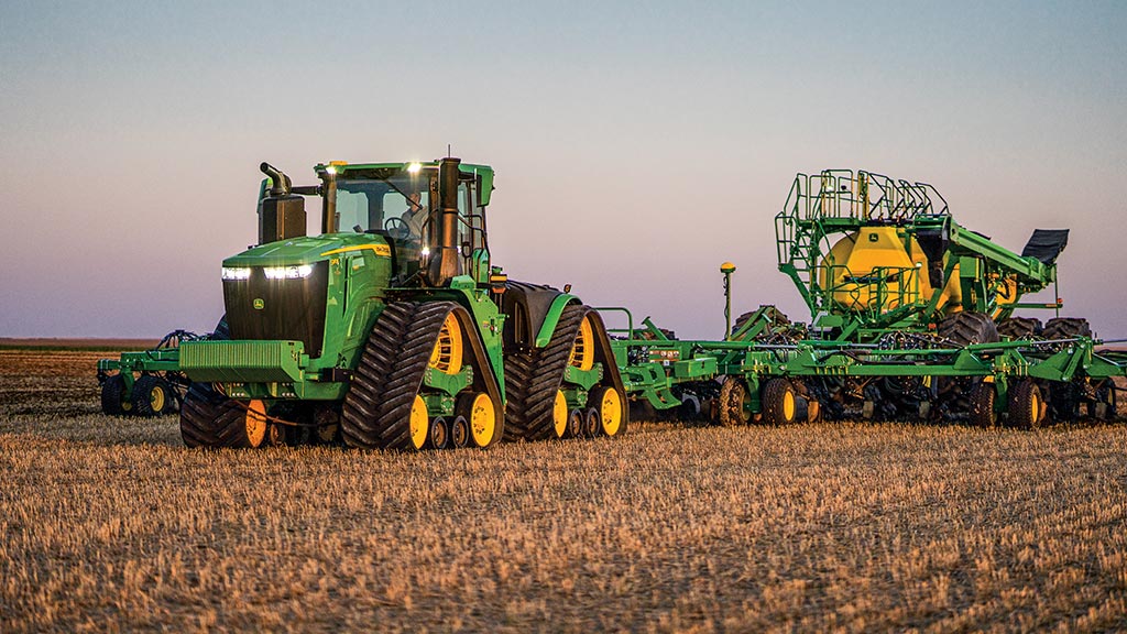 John Deere 4WD 9 Series Tractor pulling air seeder in a small grains paddock