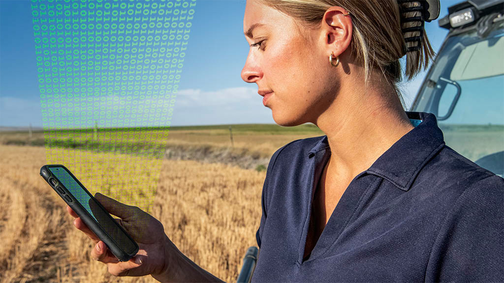 Small grain farmer using John Deere Operations Center in a paddock.