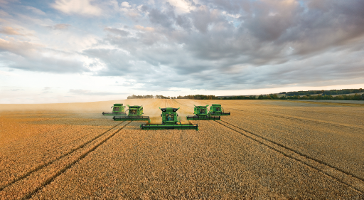 agriculture financing harvesters in a field